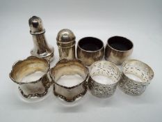 A collection of hallmarked silver items comprising six napkin rings (two are silver mounted to a