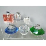 Tobacciana - Six glass table lighters of varying design, clear glass and coloured glass.