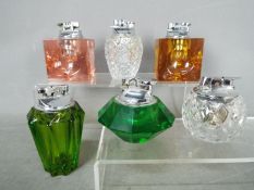 Tobacciana - Six glass table lighters of varying design, clear glass and coloured glass.