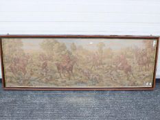 A framed tapestry depicting a hunting scene, approximately 55 cm x 152 cm.