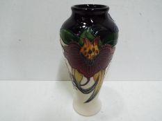 A Moorcroft ceramic Anna Lily vase, approx 20.