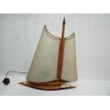 A vintage lamp in the form of a yacht, a