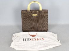 A vintage Mulberry handbag with gold ton