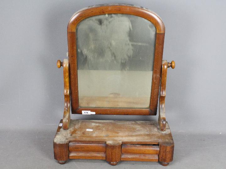 A Victorian toilet mirror with twin draw