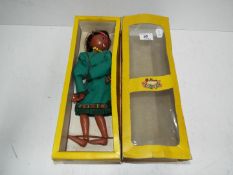 A boxed Pelham puppet