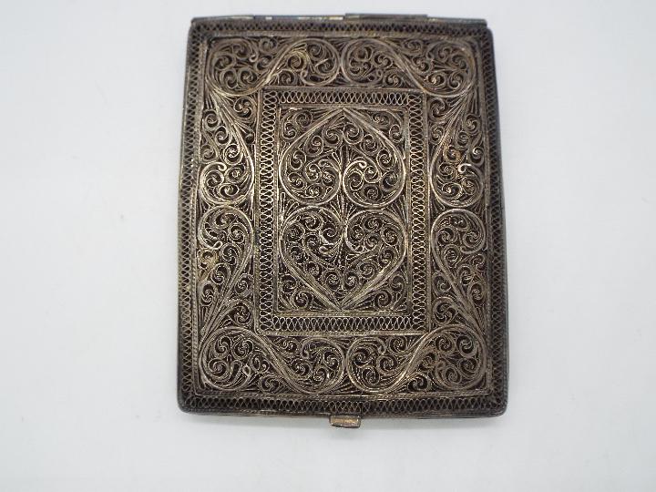 An attractive, white metal, filigree cigarette case 9.5 cm x 7.5 cm, 138 grams all in. - Image 2 of 4