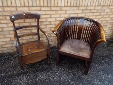 A good quality wood tub chair with leather upholstered seat and a commode chair.