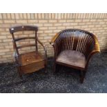 A good quality wood tub chair with leather upholstered seat and a commode chair.