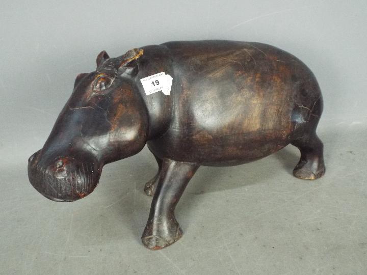 A carved, hardwood hippopotamus,