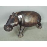 A carved, hardwood hippopotamus,