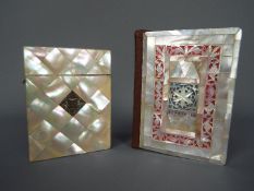 A mother of pearl calling card case with hinged cover and inset white metal plaque and a mother of