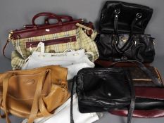 A collection of lady's handbags