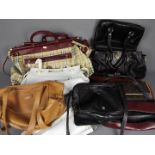 A collection of lady's handbags