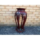 A Chinese hardwood jardiniere stand with carved detailing, approximately 62 cm x 30 cm.