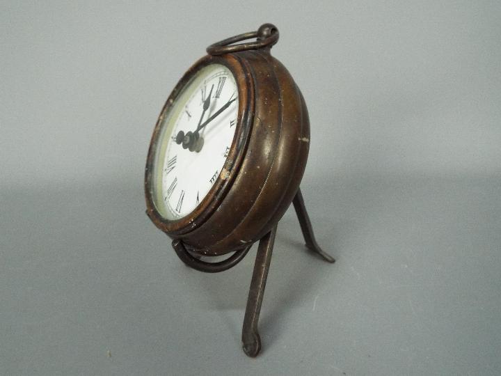 A small, antique style desk clock in the form of a pocket watch, with stand, - Image 2 of 2