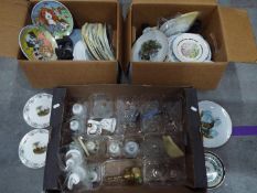 A quantity of various collector plates and ornamental bells, three boxes.