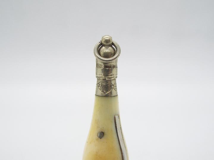 A late Victorian ivory and white metal novelty cigar cutter in the form of a champagne bottle, - Image 4 of 4