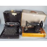 A vintage electric sewing machine marked CS Family Alexander and an Everest portable typewriter.
