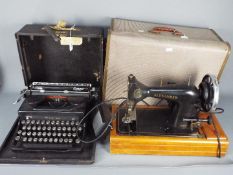 A vintage electric sewing machine marked CS Family Alexander and an Everest portable typewriter.