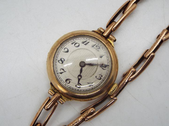 A lady's 9ct gold cased wristwatch on expanding bracelet marked Britannic 9ct (bracelet A/F), - Image 2 of 5