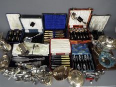 A collection of mixed metal ware, predominantly plated, part cased.