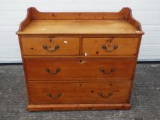 A pine chest of two over two drawers measuring approximately 98 cm x 105 cm x 51 cm.