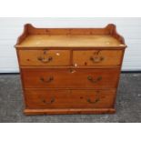 A pine chest of two over two drawers measuring approximately 98 cm x 105 cm x 51 cm.