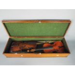 Two violins with bows, no makers name found, contained in wooden case.