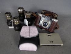 Two pairs of Verres 8 field glasses, a Braun Paxette camera and similar.