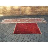 A rug measuring approximately 155 cm x 105 cm and a runner 375 cm x 80 cm.