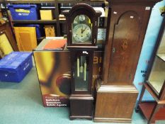 A modern Tempus Fugit longcase clock with pendulum and two weights,