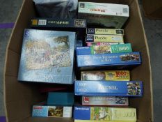 A collection of boxed jigsaw puzzles.