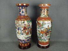 Two large vases, each decorated with figures in a landscape setting , approximately 60 cm (h),