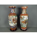 Two large vases, each decorated with figures in a landscape setting , approximately 60 cm (h),