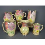 A quantity of Art Deco, Arthur Wood, ceramics with floral decoration and silvered rims,