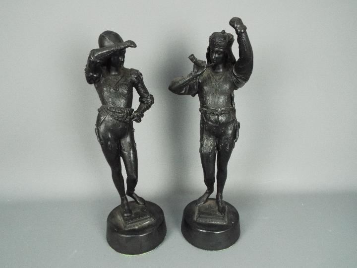 Two cast metal sculptures raised on circular plinths, approximately 47 cm (h).