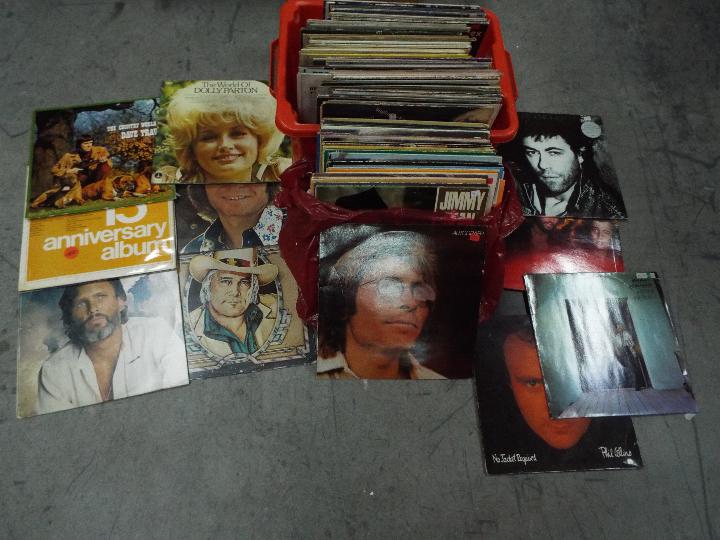 A collection of 12" vinyl records to include Dr Hook, The Bee Gees, Bob Geldof, Phil Collins,