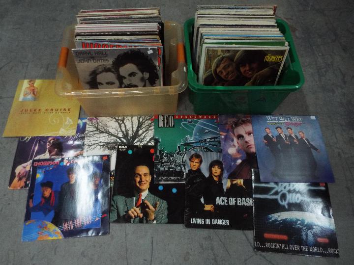 Two boxes of 12" vinyl records to include Erasure, Status Quo, Wet Wet Wet, The Monkees,