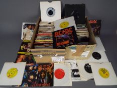 Two boxes of 7" vinyl records to include The Rolling Stones, AC/DC, Queen,