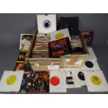 Two boxes of 7" vinyl records to include The Rolling Stones, AC/DC, Queen,