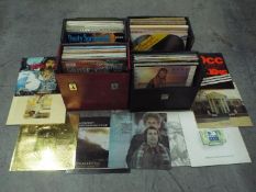 Four carry cases of 12" vinyl records to include OMD, The Carpenters, Rod Stewart, Cat Stevens,