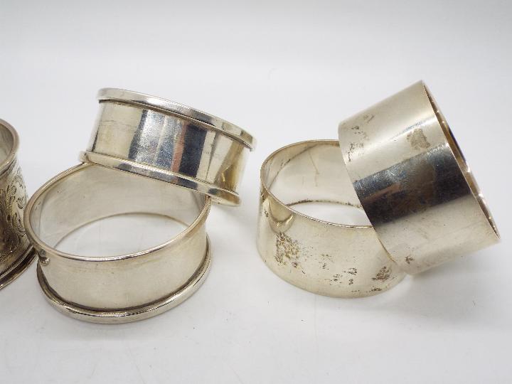 Five hallmarked silver napkin rings, varying assay and date marks, approximately 98 grams / 3. - Image 3 of 3