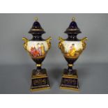 A pair of Vienna style, porcelain urns and covers,