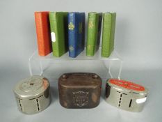 Eight vintage savings money banks comprising a Williams Deacon's Bank Ltd money box with handle,
