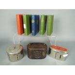 Eight vintage savings money banks comprising a Williams Deacon's Bank Ltd money box with handle,