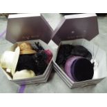 Two hat boxes containing a quantity of lady's hats.