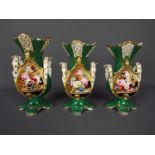 A set of three graduated vases decorated with panels of floral sprays and landscape scenes,