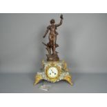 An early 20th century French figural mantel clock, the case of pale green and white marble,