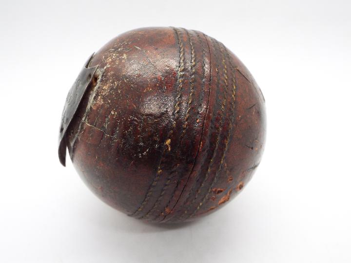 An antique cricket ball with silver presentation shield M.F.C.C.C J Sayle Hat Trick Aug 12th 1911. - Image 3 of 3