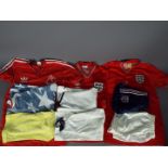 A collection of vintage, replica football shirts, 1980's and later, varying sizes.